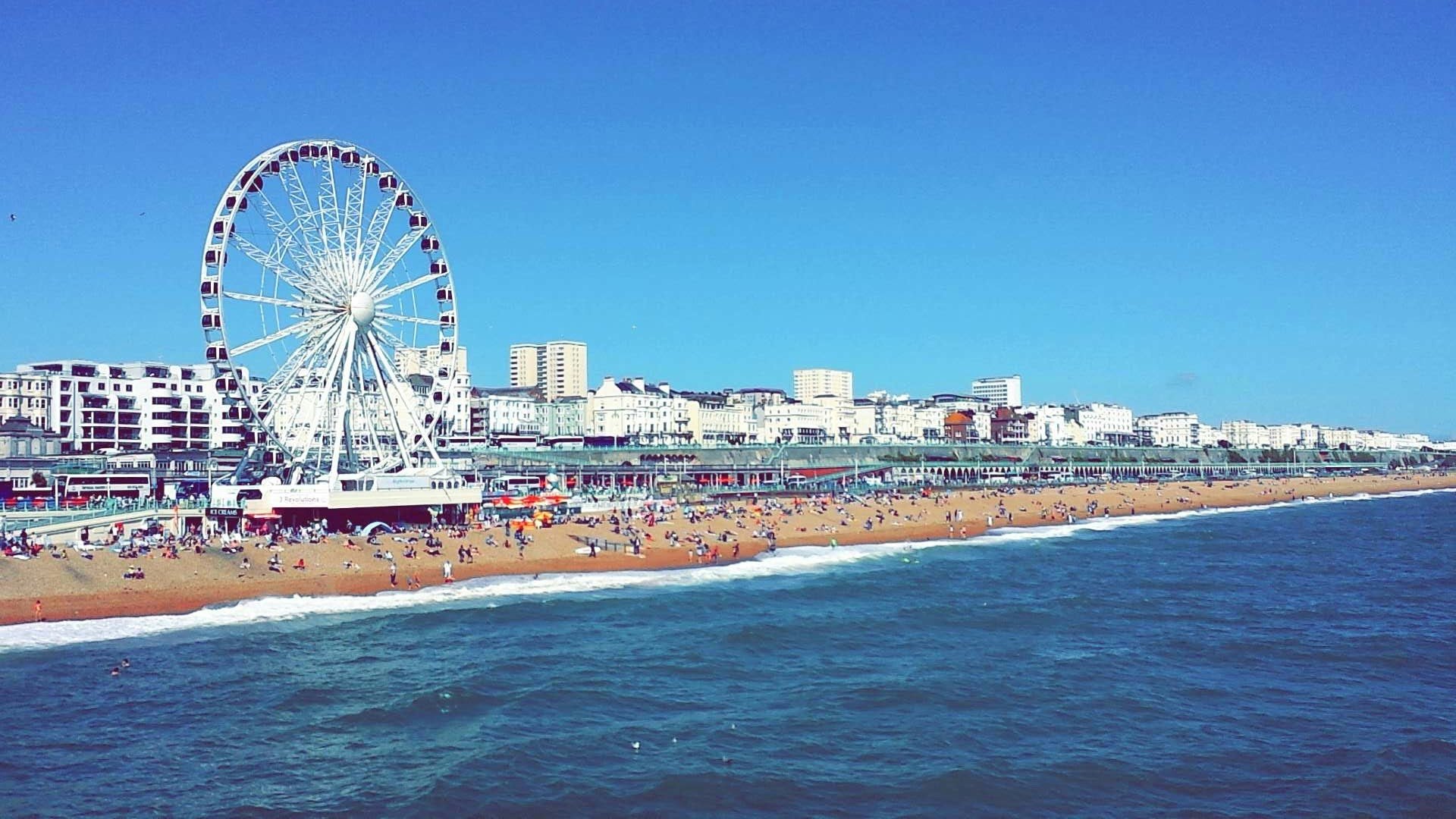 view of brighton beach with the big wheel in the sunshine