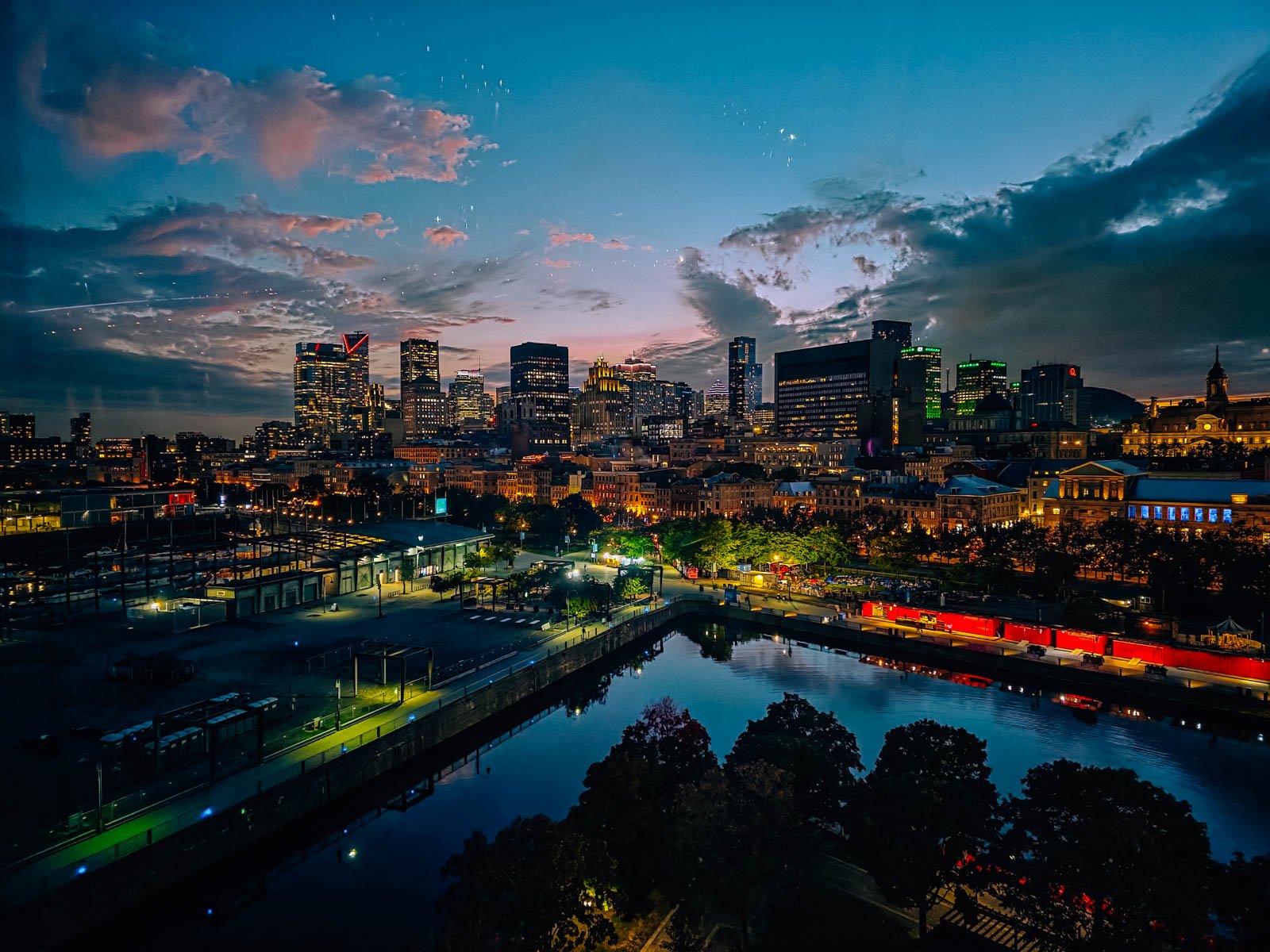 An aerial view from a ferris wheel of a sky skyline lit up at night