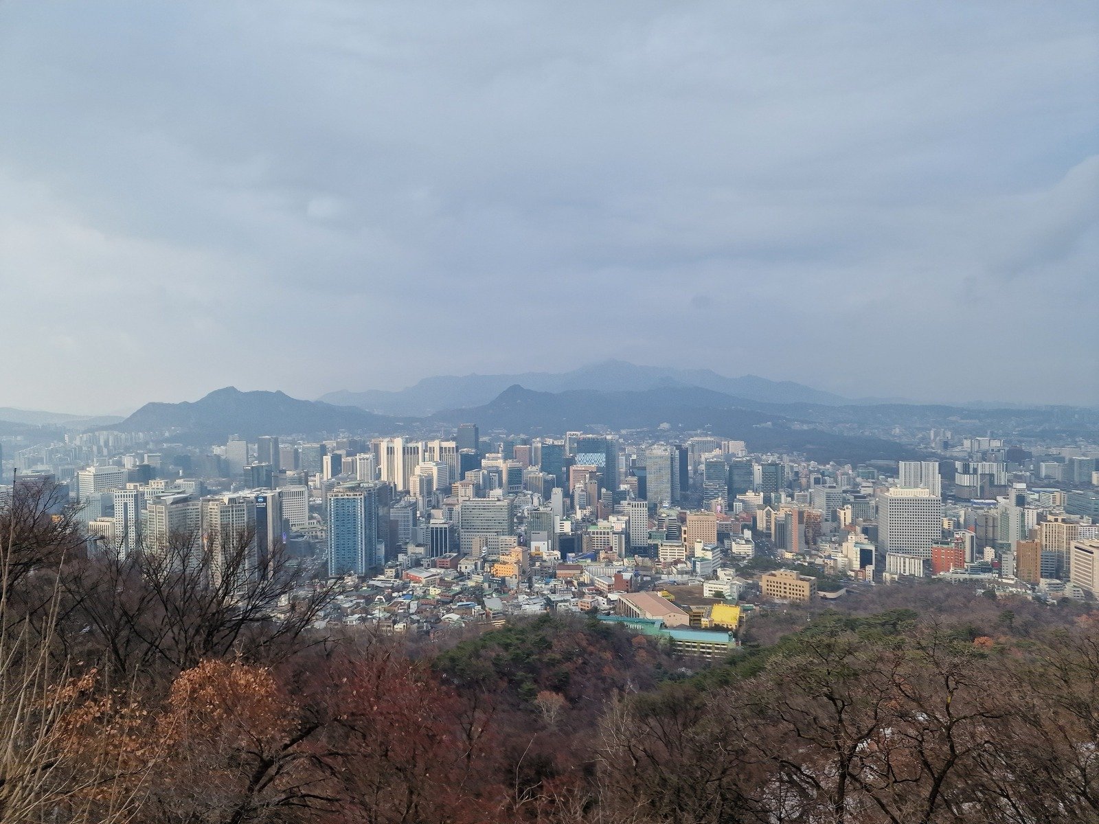 a view of Seoul city from the top of a mountain