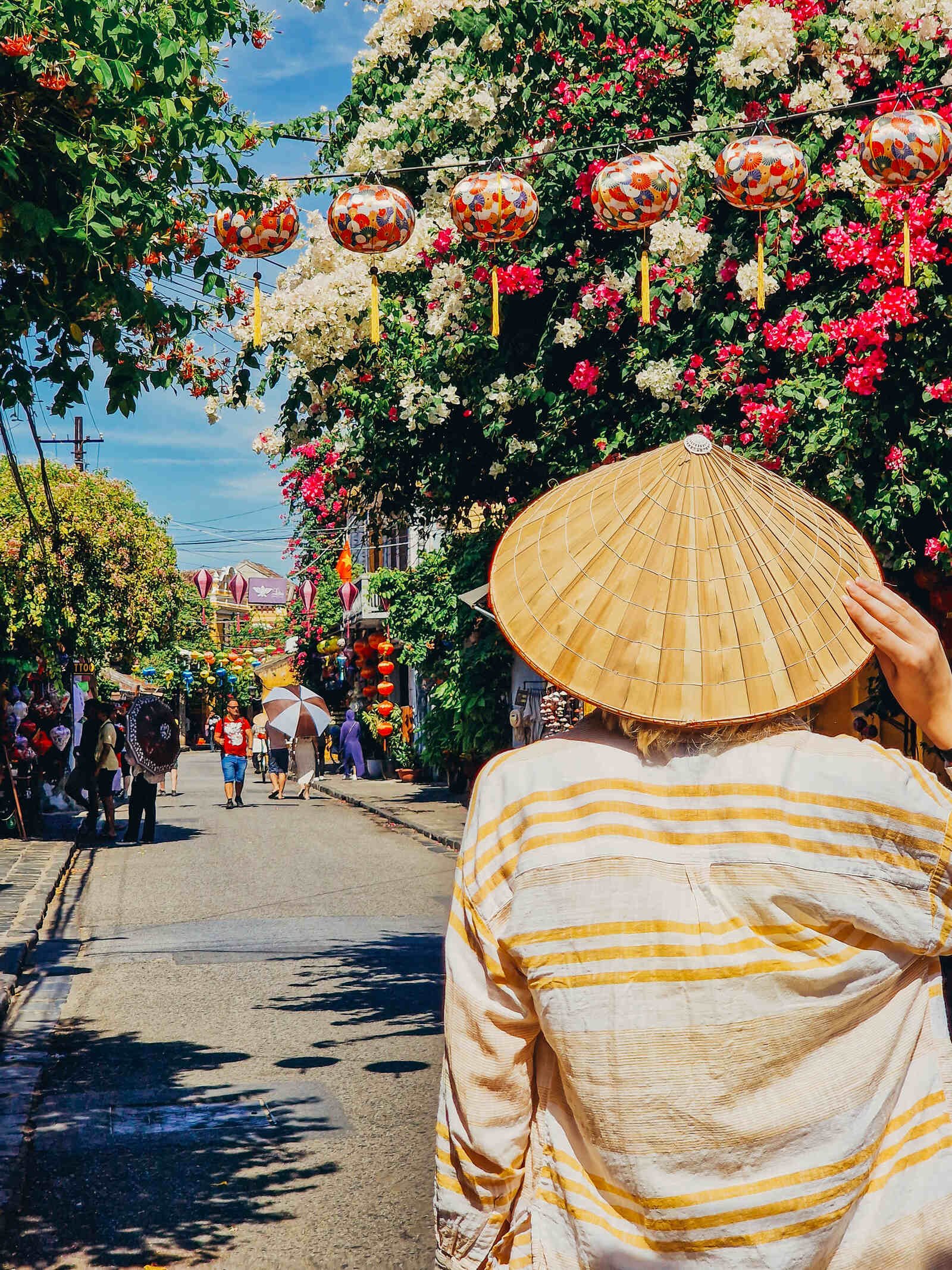 walking down the ancient streets of hoi an with lantern decorations