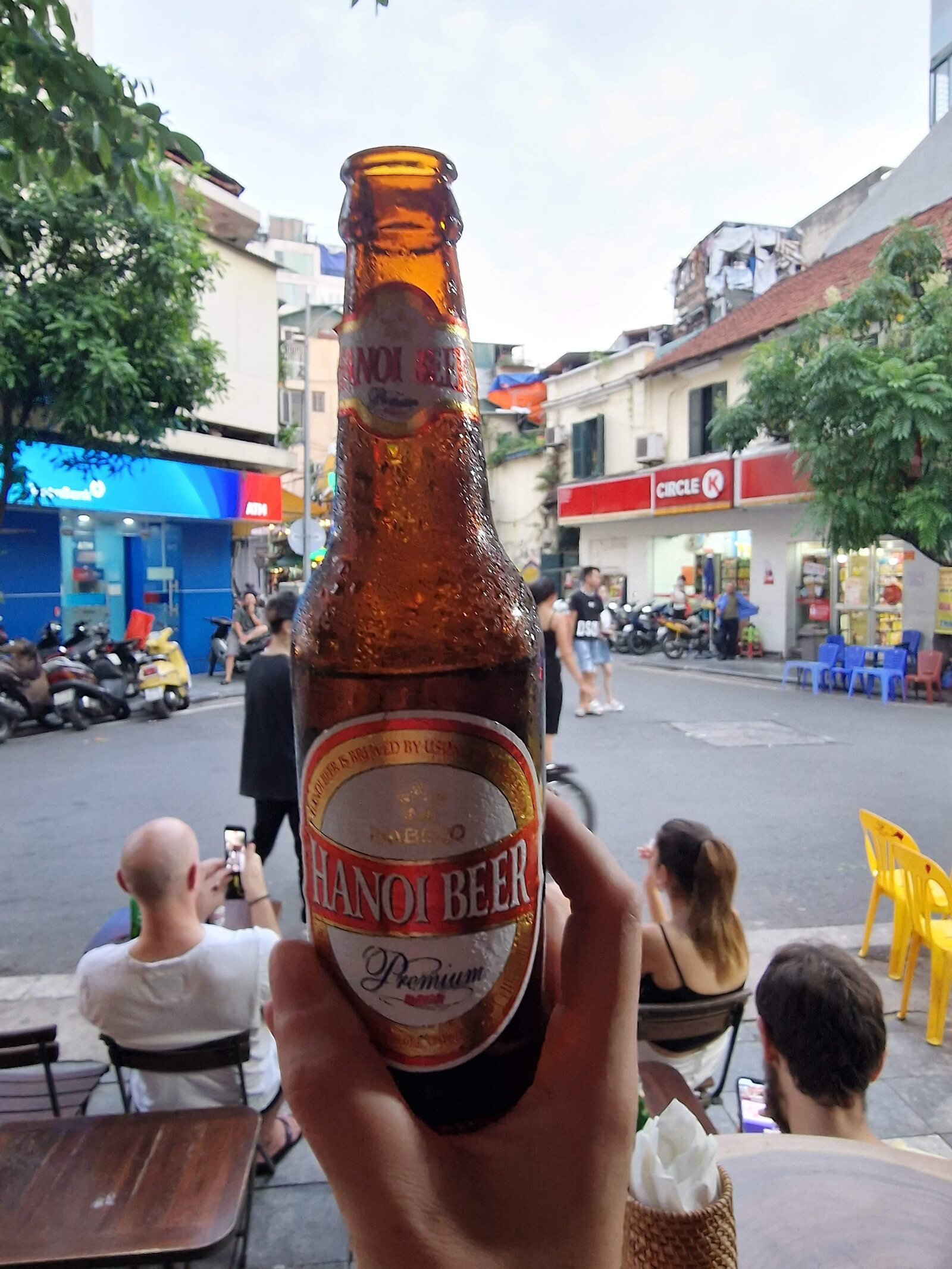 hanoi beer bottle with a street background