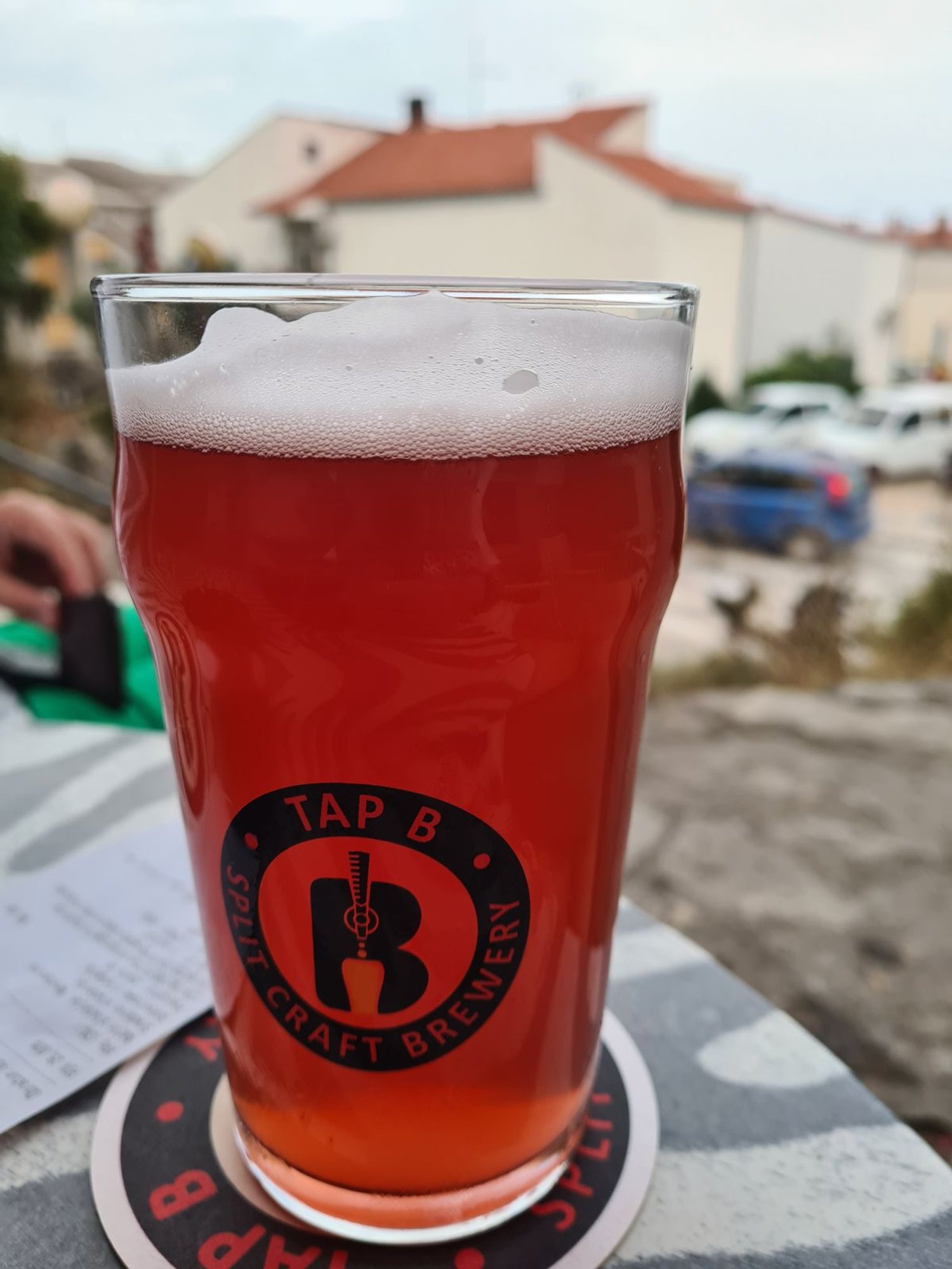 red coloured beer in a craft beer pint glass