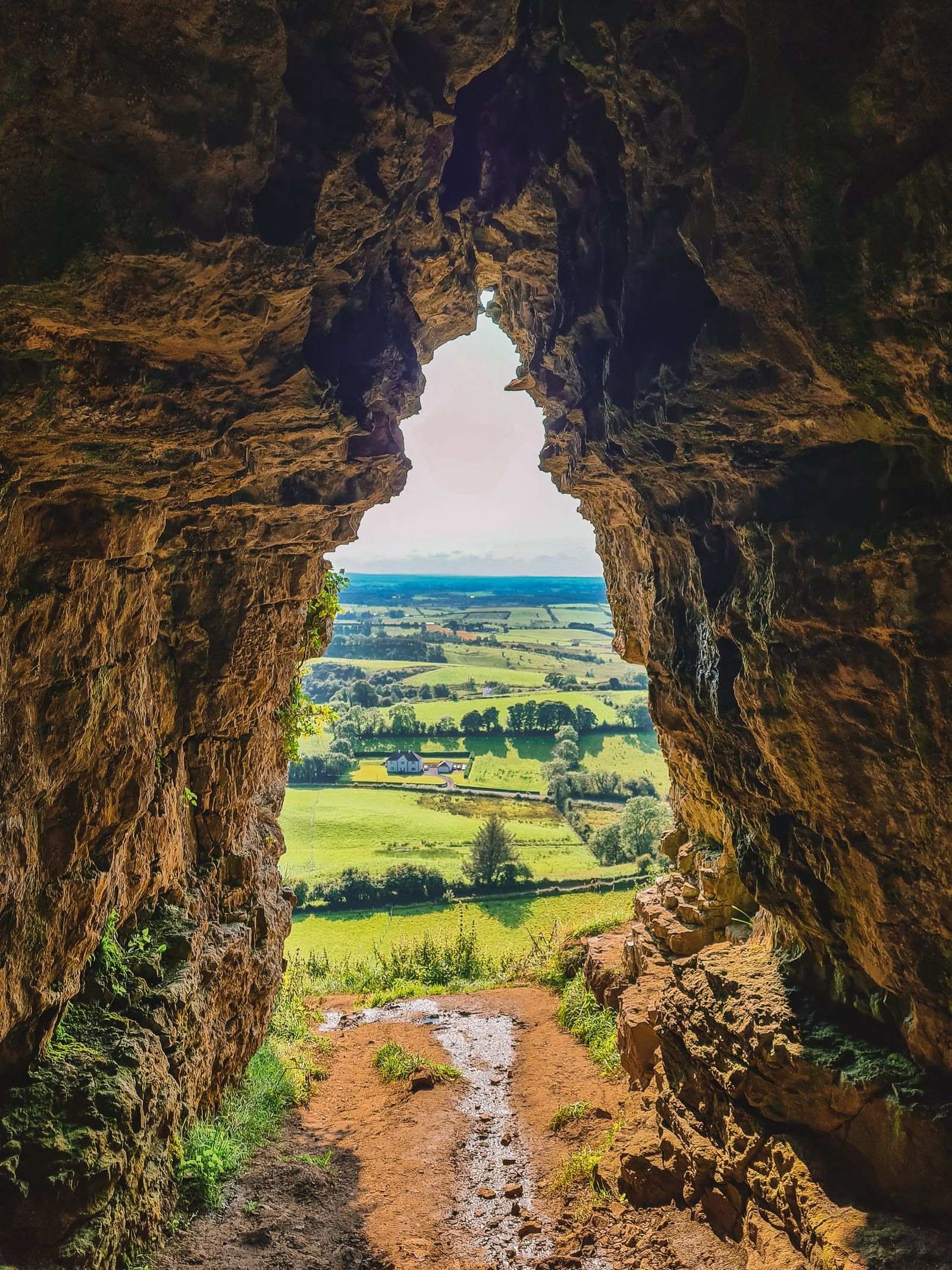Exit of a cave looking out to a field