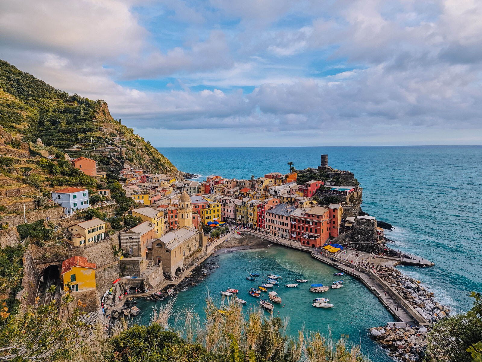 the view overlooking a blue harbour at Vernazza village in cinque terre