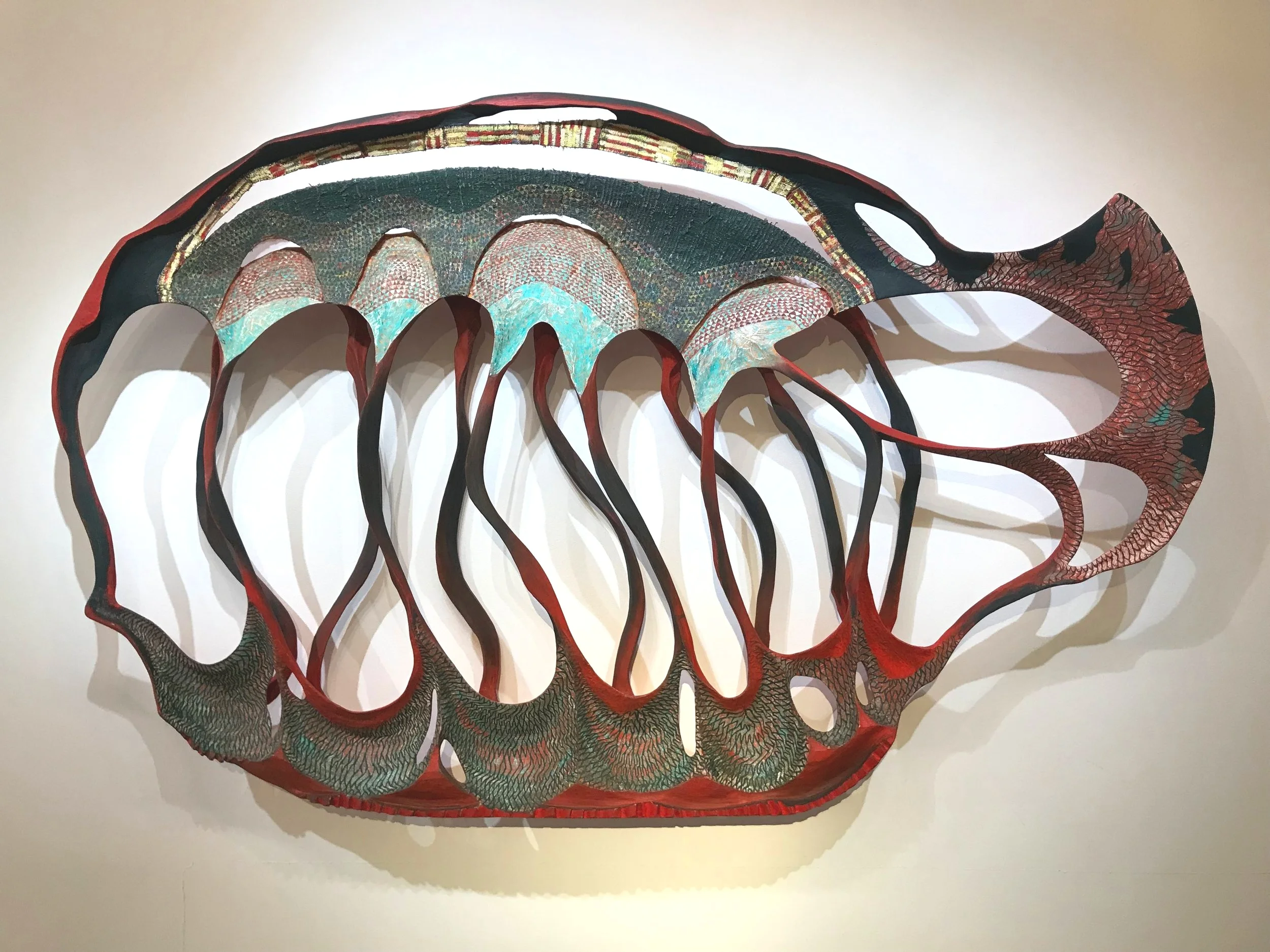 Becca Lowry, the Santa Anas (2019). Mixed media wood carving; 44” h x 68-1/2” w x 8” d. Image: J. Gleisner.
