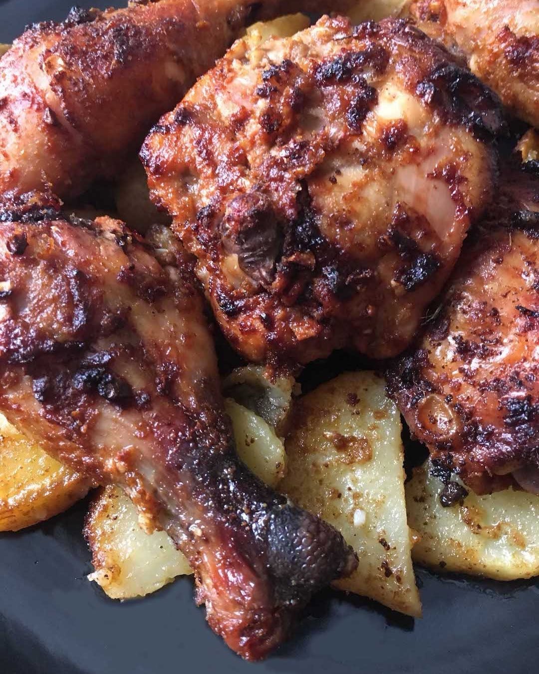 Our Recipe of the Week is Chicken in the Oven with Potatoes from &quot;The Bread and Salt Between Us,&quot; by Mayada Anjari with Jennifer Sit. Chicken pieces in a quick marinade of vinegar, tomato paste, garlic, cumin, and cayenne and roasted on a b
