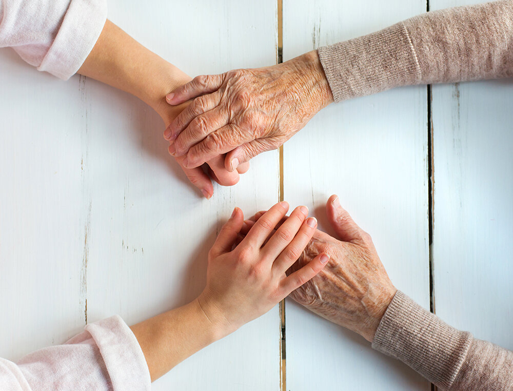 senior-woman-holding-hands