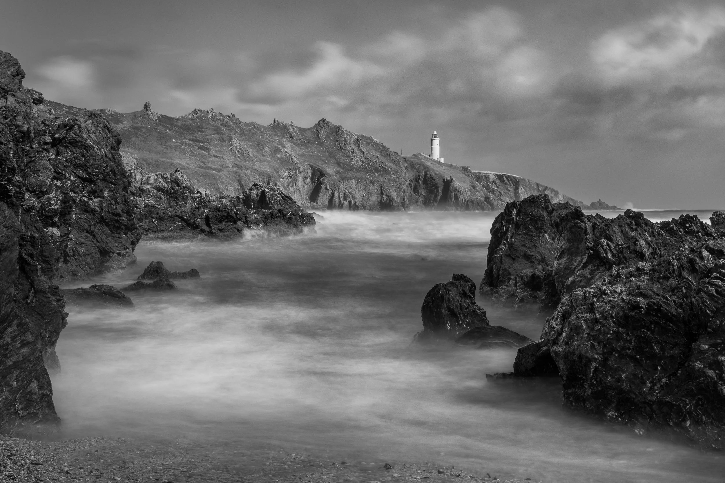 Black and white photography picture of lighthouse in storm as fine art wall art print