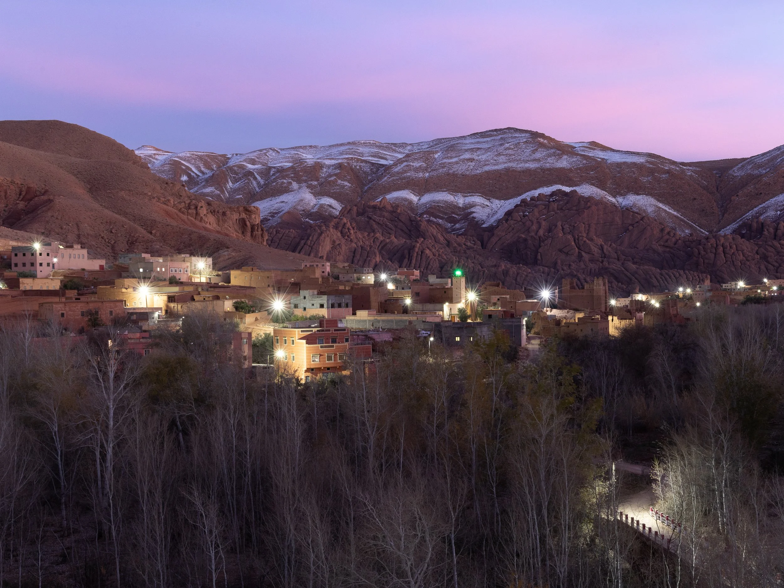 Snow on the High Atlas mountains above a village in Morocco