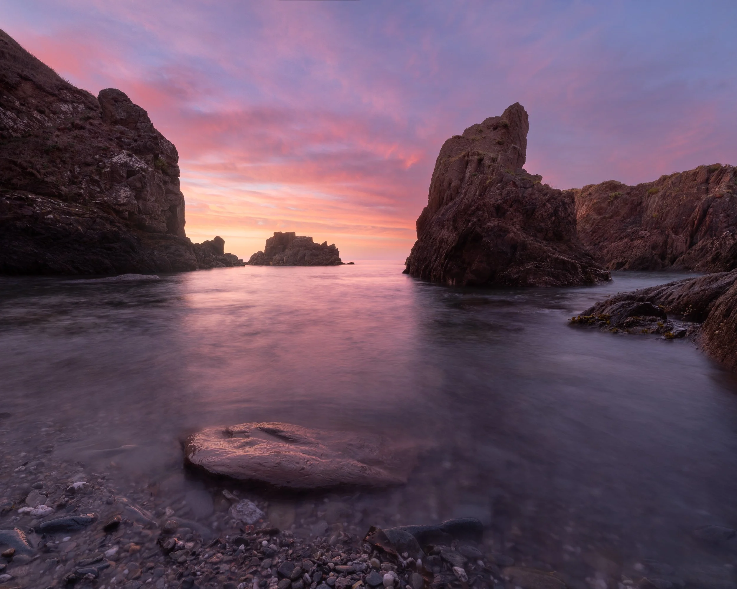 Sunrise in South Devon sea cove