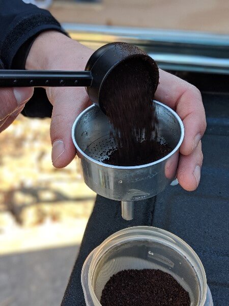 mid ground coffee in grounds basket of bialetti moka express espresso coffee maker