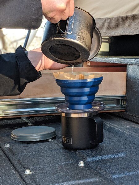 pouring water from pot into gsi javadrip pour over 