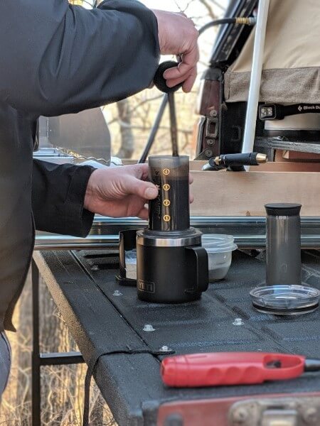 stirring coffee grounds in aeropress chamber