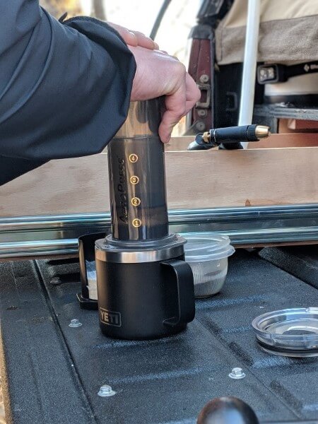 using press plunger to make aeropress camping coffee