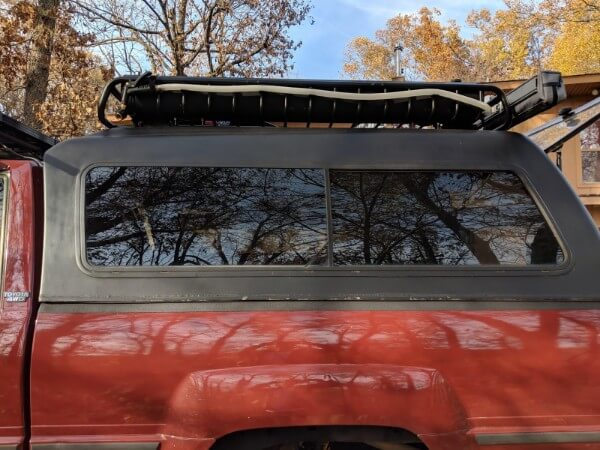 side screened sliding window on aluminum truck canopy for truck camping ventilation