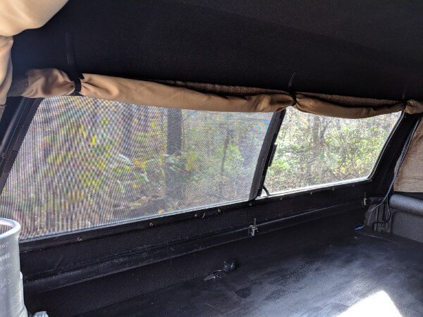 interior view truck canopy side sliding window with screen for sleeping ventilation