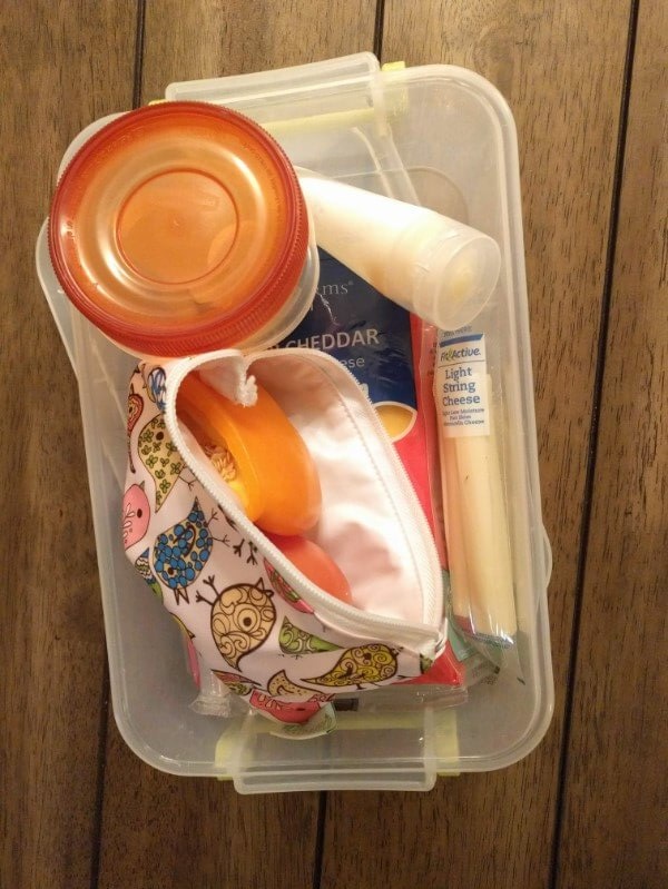 small container to organize camping food inside a cooler or fridge for easy cooking
