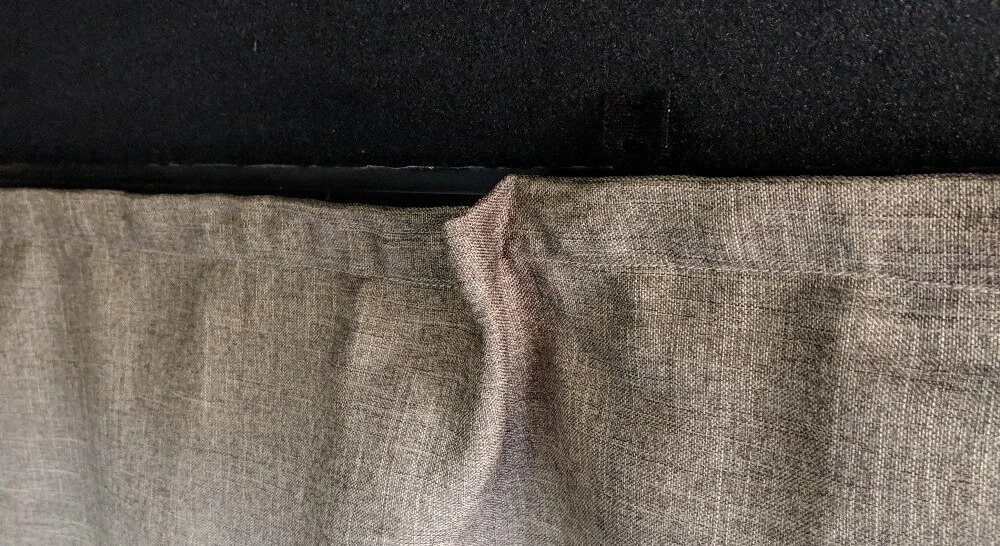 Comparison of camper curtain covering the frame vs not when mounted, depending on the velcro placement on the fabric.
