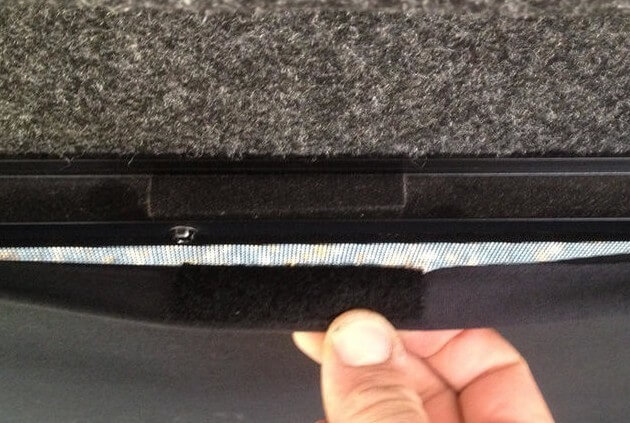 Use velcro tabs between your curtain and window frame or siding to hold the curtain against the side of your camper.