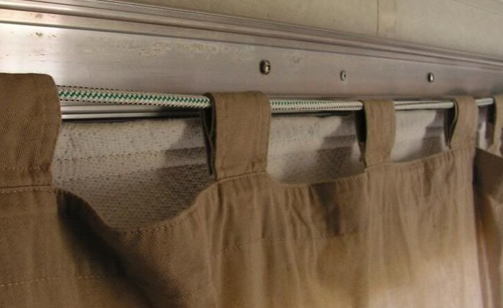 DIY camper curtains hung too low for window covers.