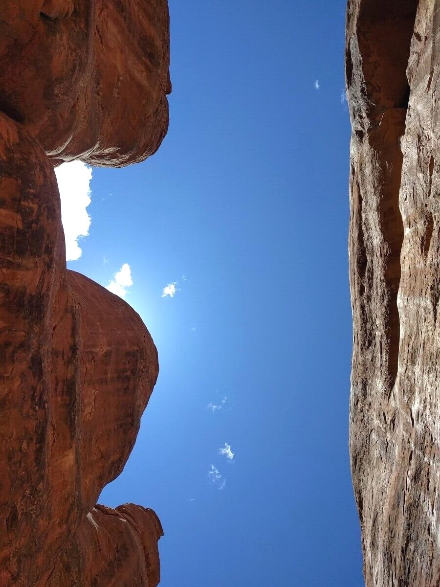 Sandstone fins providing shade for kids to play in Arches National Park Moab Utah