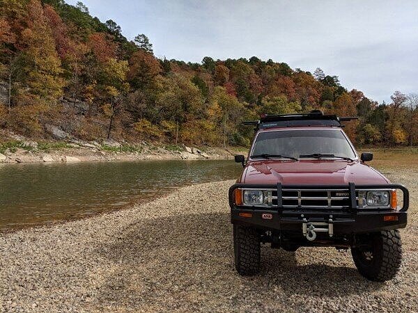 front bumper arb of toyota overland vehicle parked by lake