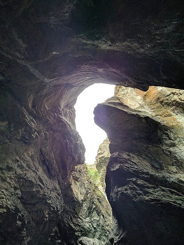 sunlight showing through cave like chasm zapata falls