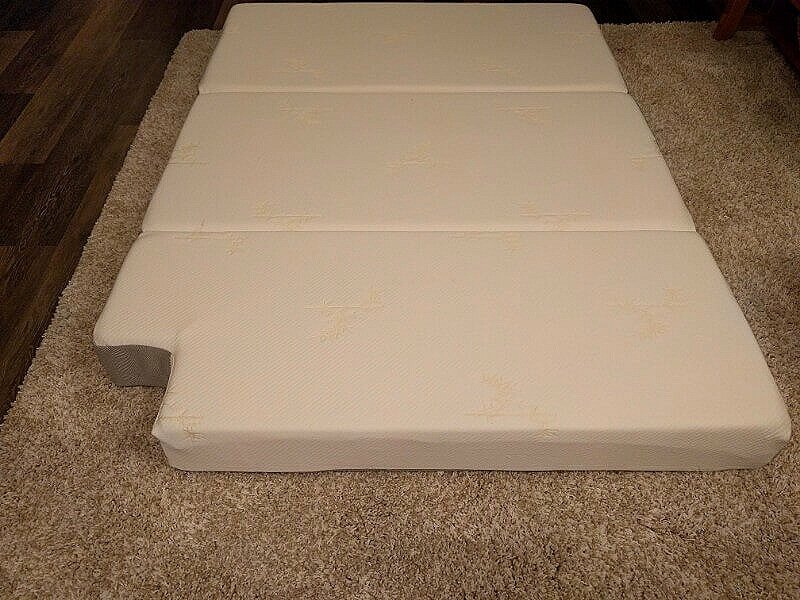 trifold foam mattress cut with knife and recovered with zippered cover