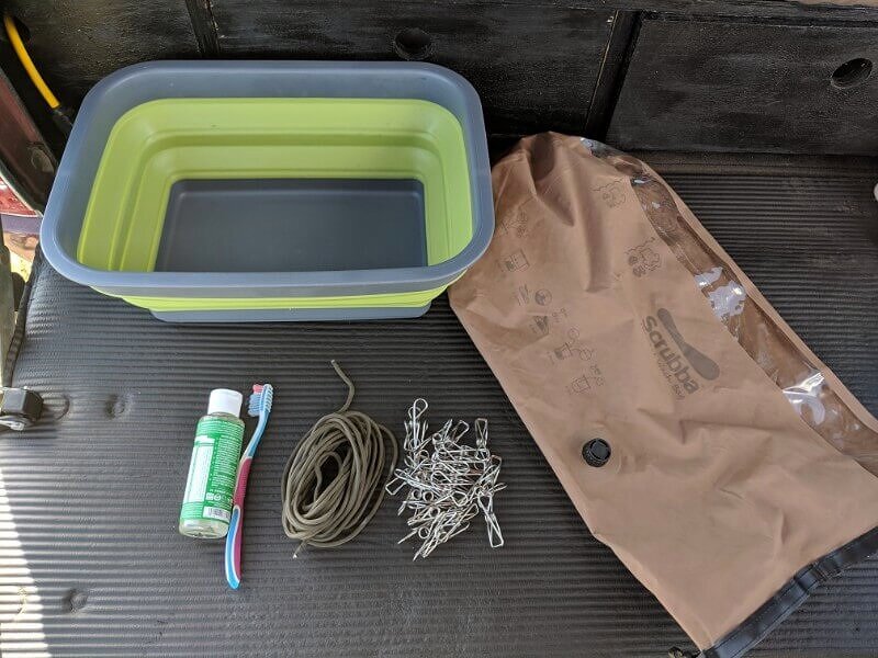 This Wash Bag Makes Cleaning Your Clothes While Camping As Easy As