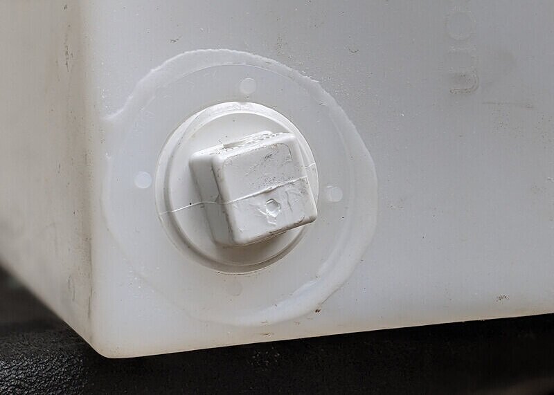 DIY camping shower drain plug installed