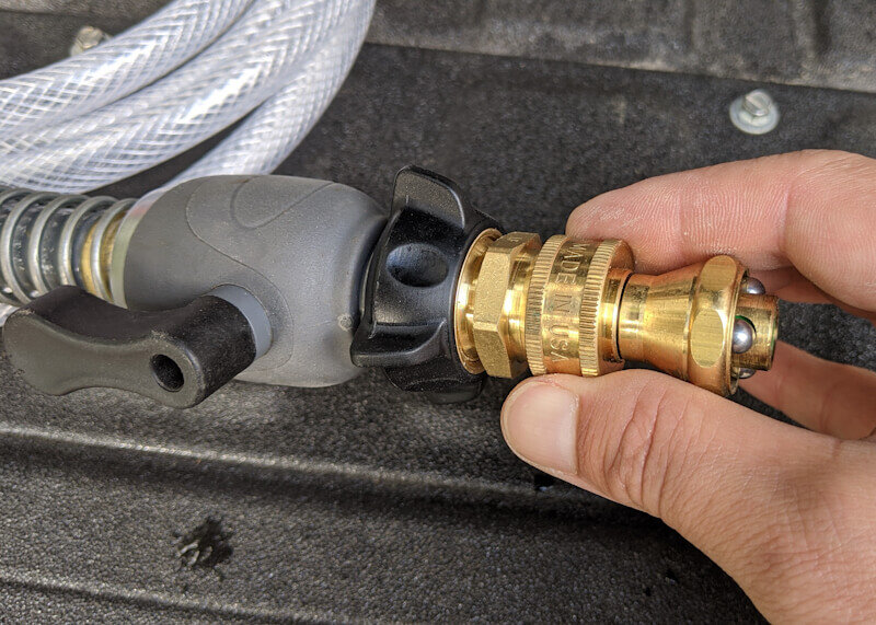 DIY camping shower nozzle installed into water container shutoff valve