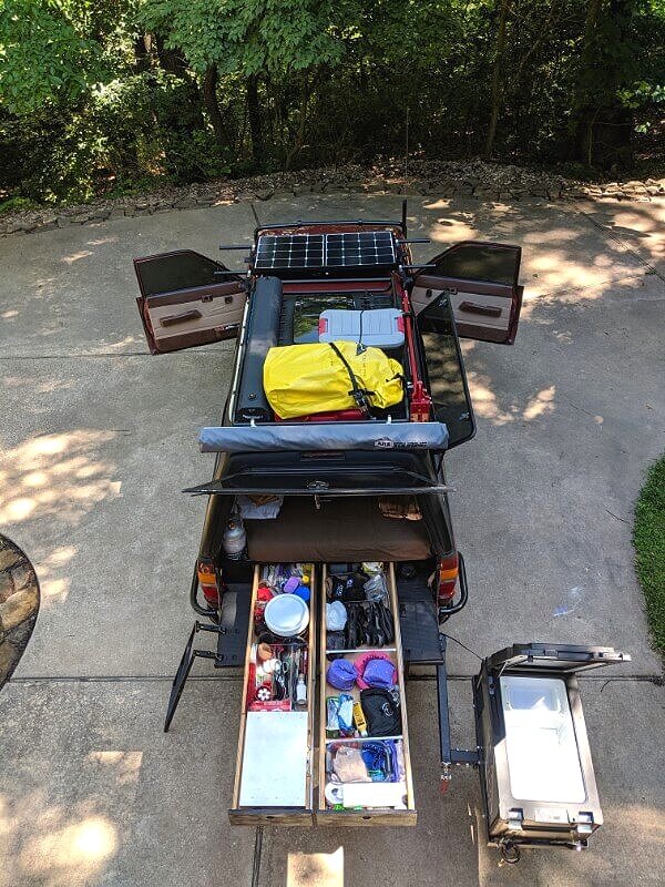 Truck Camping Gear and Accessories Loaded In Sleeping Platform