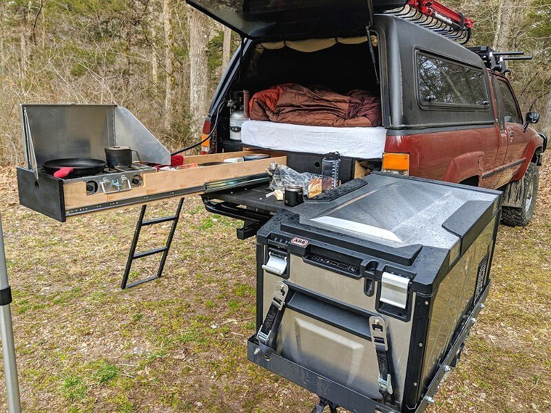 truck shell camping in old toyota with sleeping platform and drawer slides