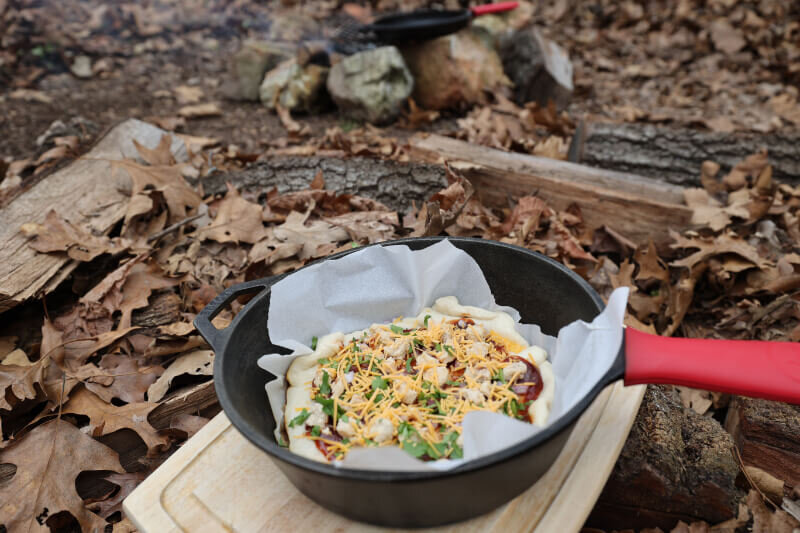 easy camping pizza cooked as dutch oven pizza