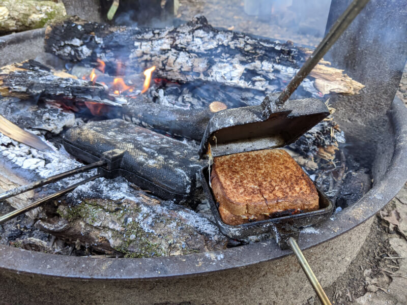 how to make pie iron pizza or pudgy pie pizza while camping