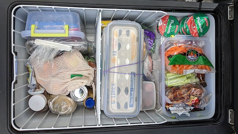 Tips and hacks for camping fridge organization or camping cooler organization.