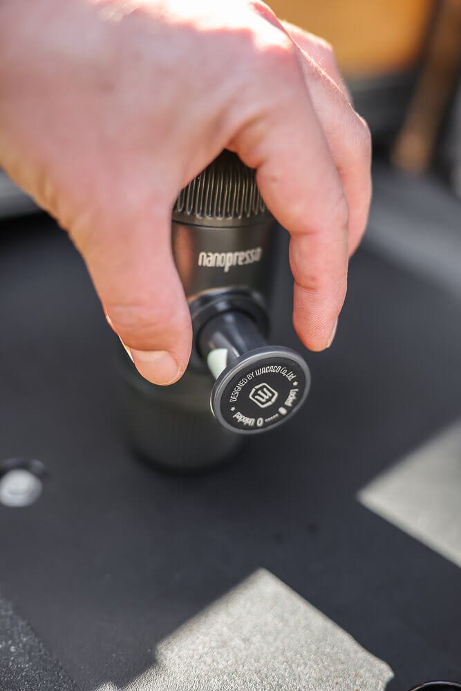 releasing the pressure piston on the nanopresso camping espresso machine