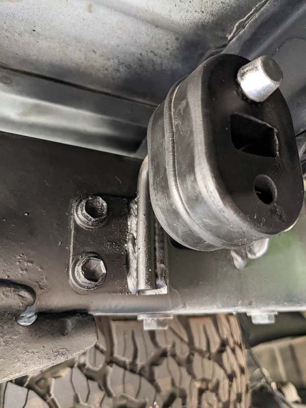 new exhaust hanger installed on first gen tacoma overland truck build