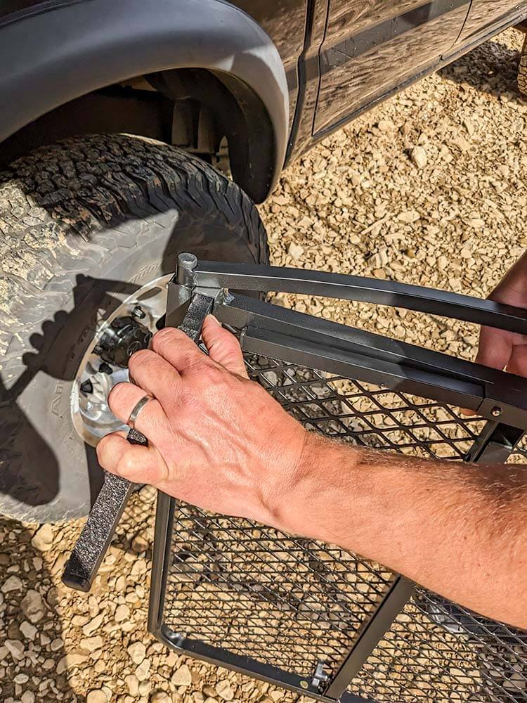 installing tire support arms into tire table for assembly at camp