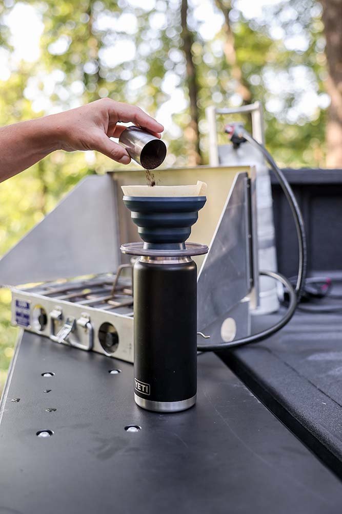 adding-grounds-camping-coffee-pour-over.jpg