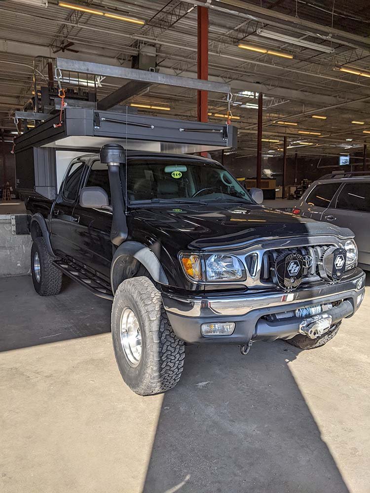tune m1 overlanding camper being installed on our tacoma overland build