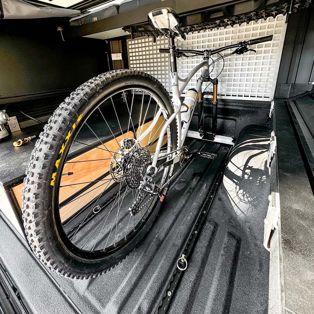 using the l-track storage and tie-down system for transporting mountain bikes while traveling