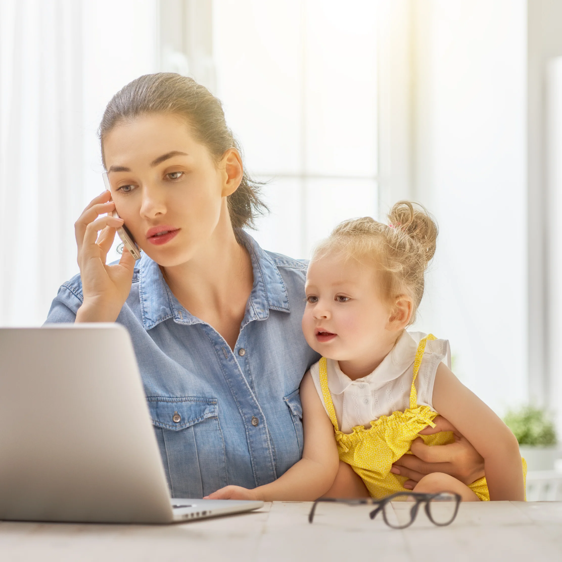 mother-with-toddler-working-PNRU45G.jpg