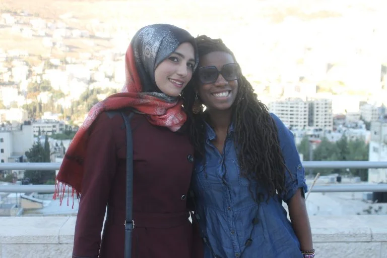 “It’s so hard to say goodbye” … EFL fellow Mecca and Step II EFL student Khadijah embrace on the last day of class.