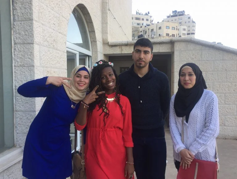 EFL Fellow Mecca and STEP II EFL Students Wurood, Jaber, and Yasmin celebrate together after a successful final performance.