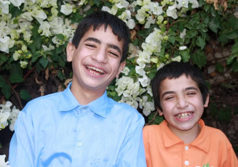 Brothers Mohamed and Abdil share a laugh between classes at TYO.