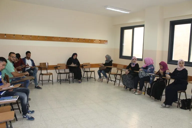 STEP! II EFL students wait for class to begin on the campus of Al Quds Open University.