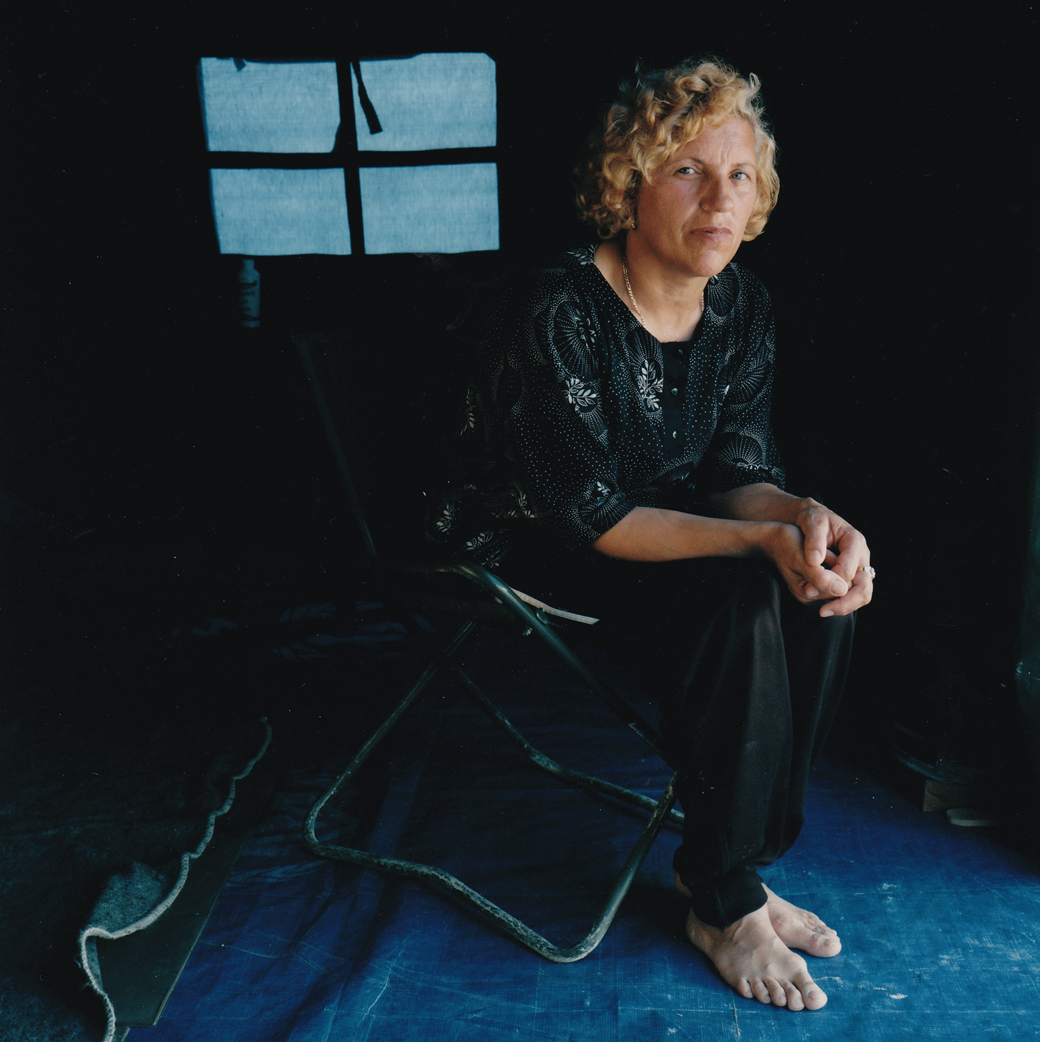 Sofia, age 47 Neprosteno camp, Macedonia, June 17 1999. “It’s been a shock adjusting to the conditions in the camp, but we feel lucky to be alive. I’m a homemaker; I tried to make the tent into our home but it’s impossible. I cook and clean all day, wash clothes as often as possible – it keeps me calm. Before we fled Kosova, our son Arben, who’s fifteen, was so scared of the Serbs he had to take tranquilizers. He doesn’t want to go back to Kosova because he’s afraid the paramilitaries and police are still there…”
