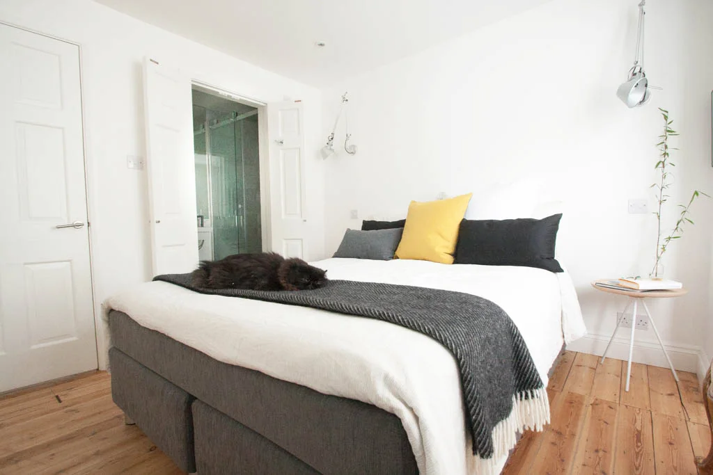 bright master suite with pops of colour