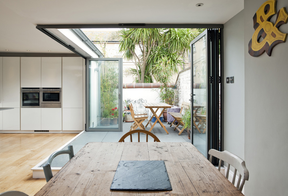 rustic dining table and contemporary kitchen and terrace